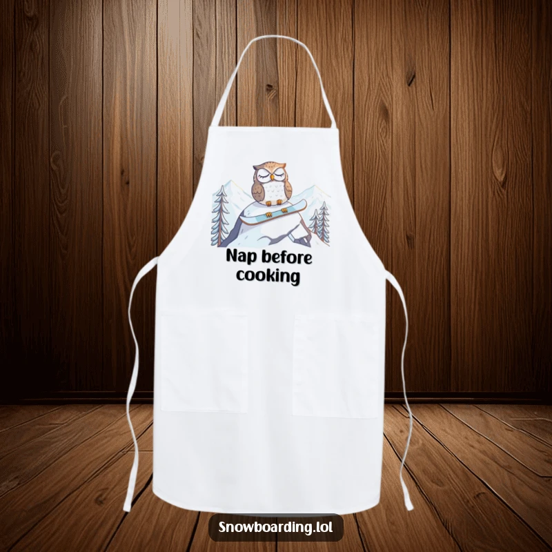 Funny apron featuring a tired owl napping on a snowboard at the mountain peak, perfect for adding humor to kitchen duties.