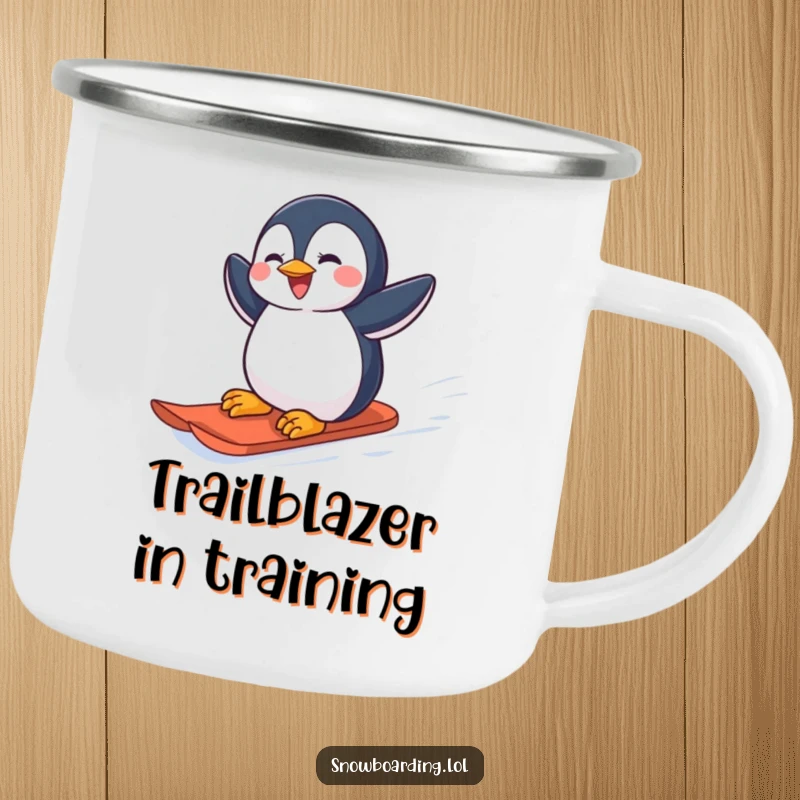 Funny joyful penguin carving down a snowy slope on a snowboard on a camping mug.