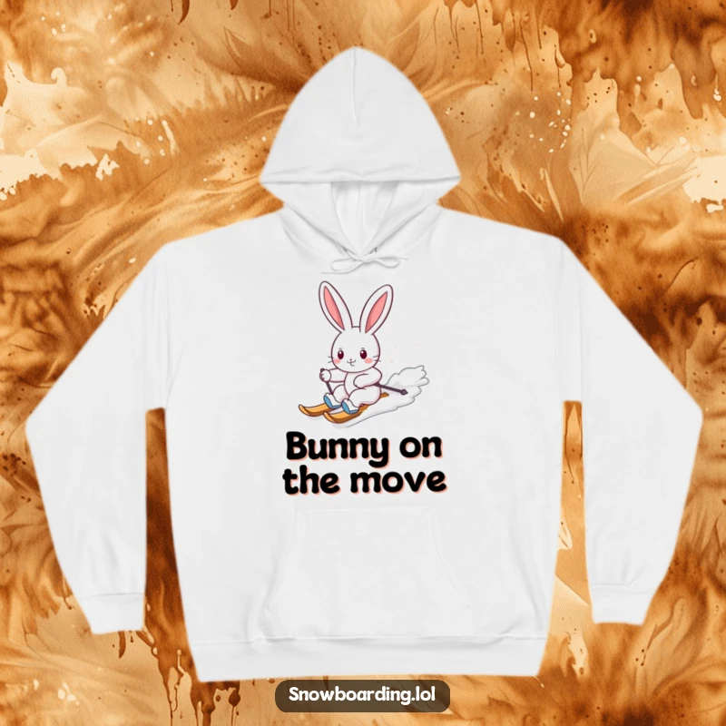 Funny hoodie showcasing a cheerful bunny skillfully carving down a snowy slope on a snowboard, embodying winter fun and joy.