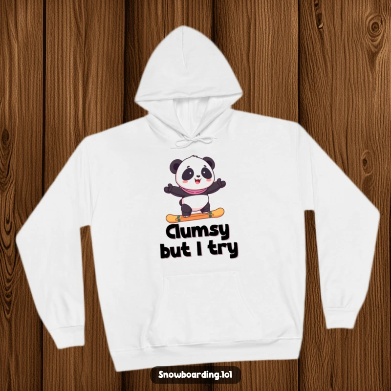 A warm hoodie showcasing a funny, happy panda precariously balancing on a snowboard.