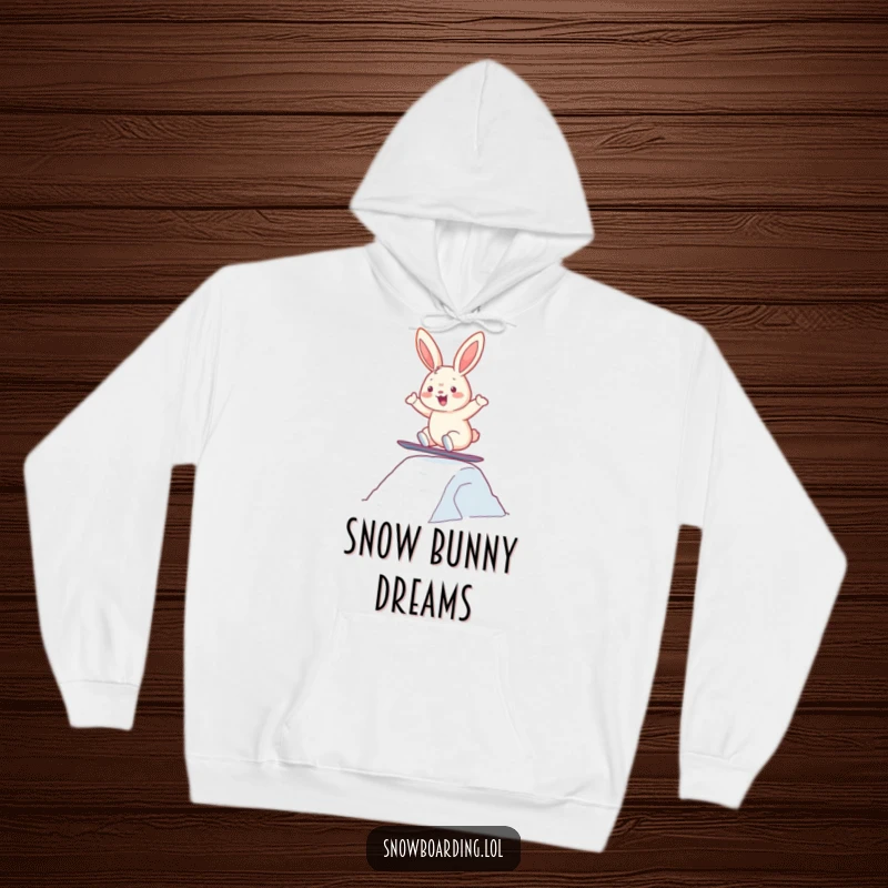 Funny hoodie depicting a happy bunny snowboarding and soaring over a snow jump, embodying pure winter fun.