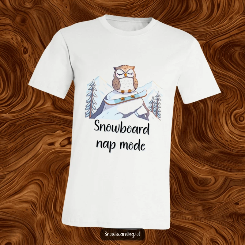 Funny t-shirt showing a tired owl napping on a snowboard at the mountain peak, embodying peak relaxation and humor.